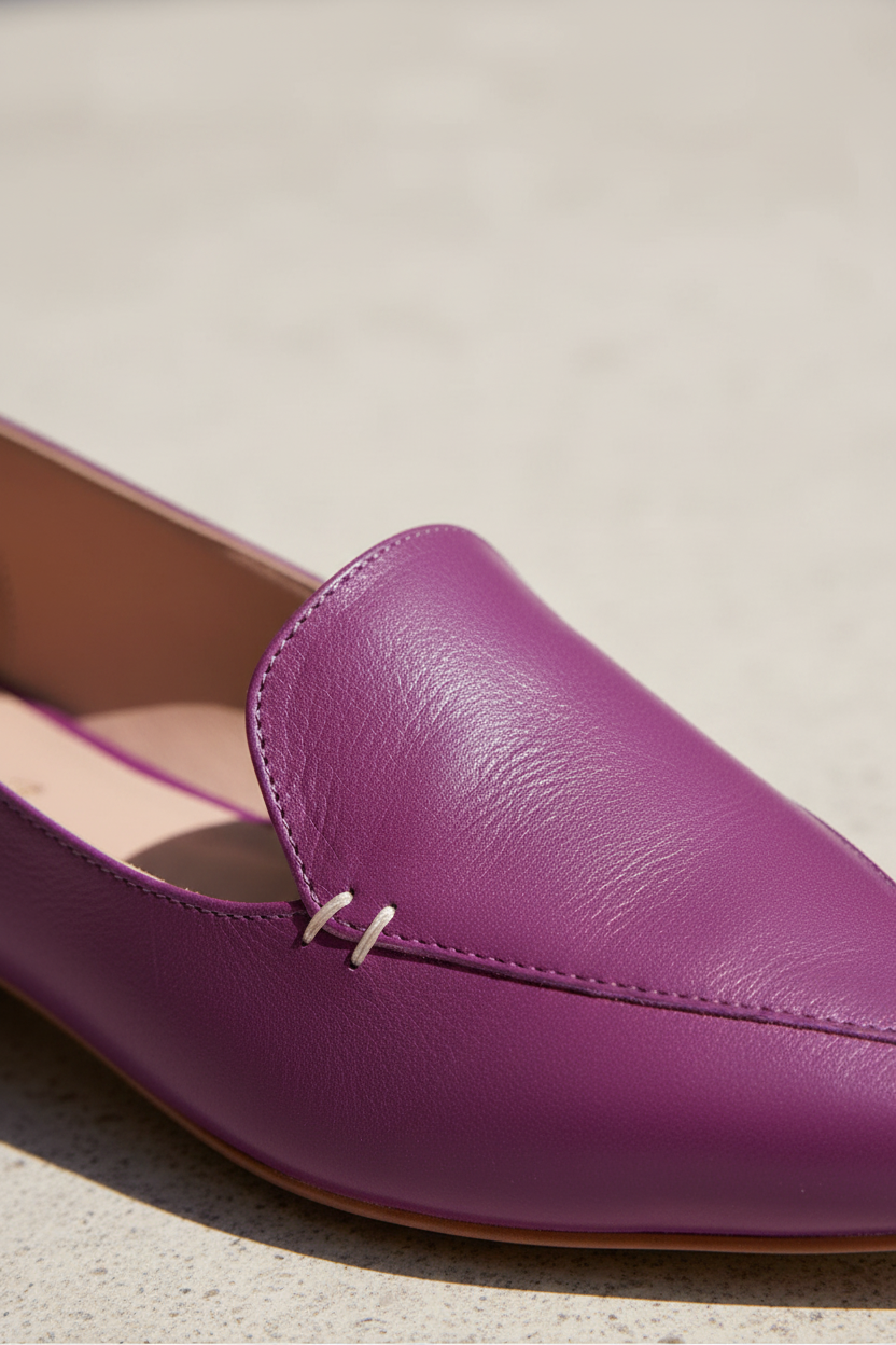 Close-up of hand-stitched detail on Butiá purple leather ballerinas