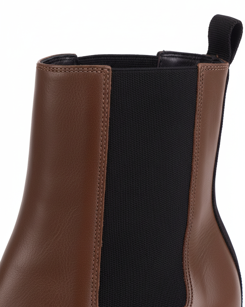 Close up detail of the black woven elastic gore against the brown leather on the Canna Chelsea boots