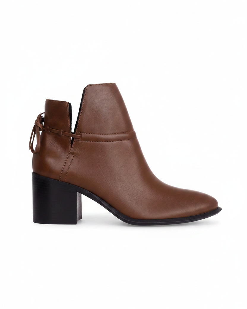 Attalea brown leather ankle boot side view showing the ankle strap, back bow and black stacked block heel