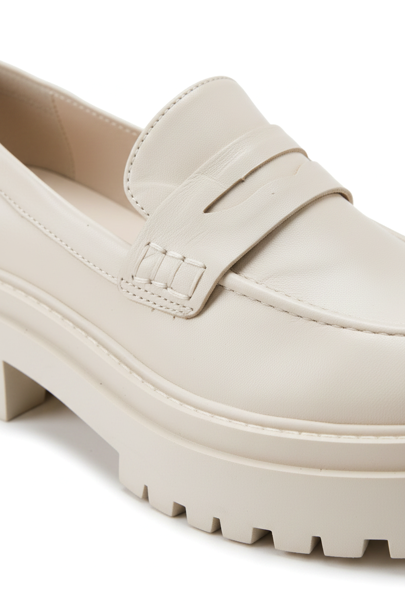 Close-up of the penny strap keyhole and lug sole on Mangara Atelier Carvalho Off-White Leather Loafers - SKU 222A0341
