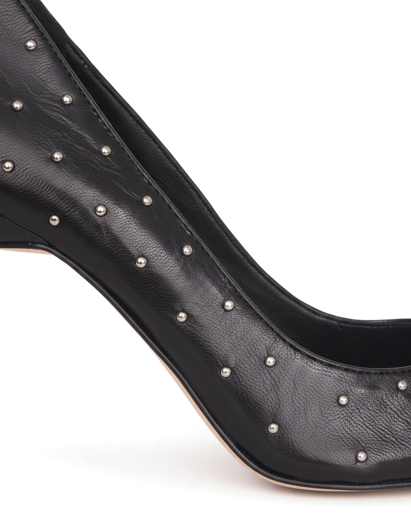 Close-up of the hand-set silver studs on the Mangará Callisia black leather pump