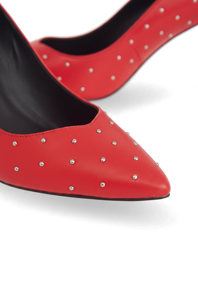 Close up detail of the hand set silver studs on the red leather vamp of the Callisia pumps