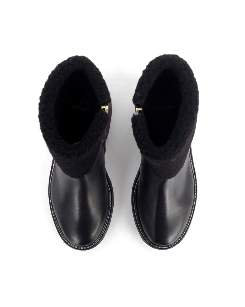 Andira black leather shearling ankle boots top view showing the gold side zip pull