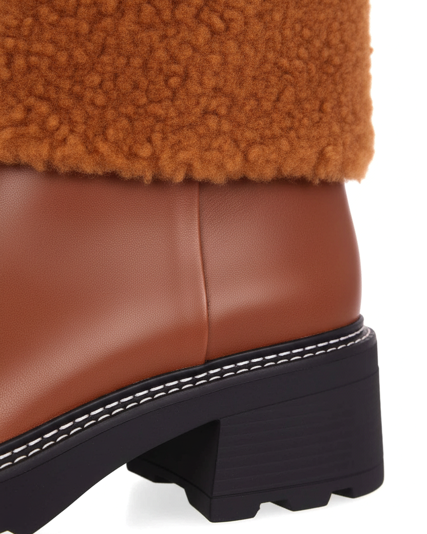Close up of white contrast welt stitching on Andira brown leather ankle boot