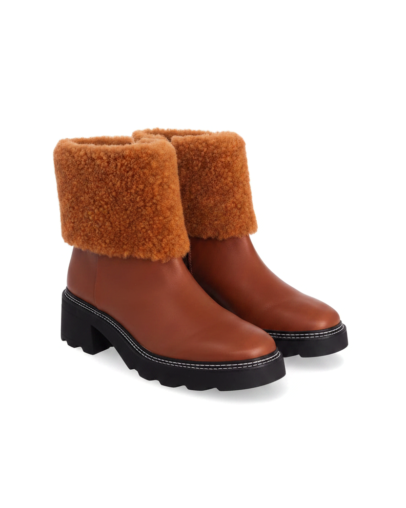Andira brown leather ankle boots with shearling collar and black lugged sole, three quarter view