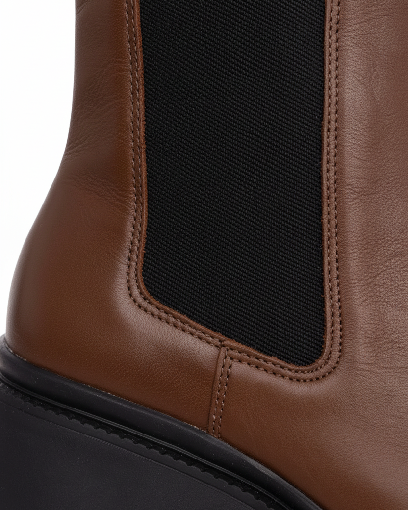 Close up of the black elastic gusset and serrated lug sole on Arachis brown leather Chelsea boots