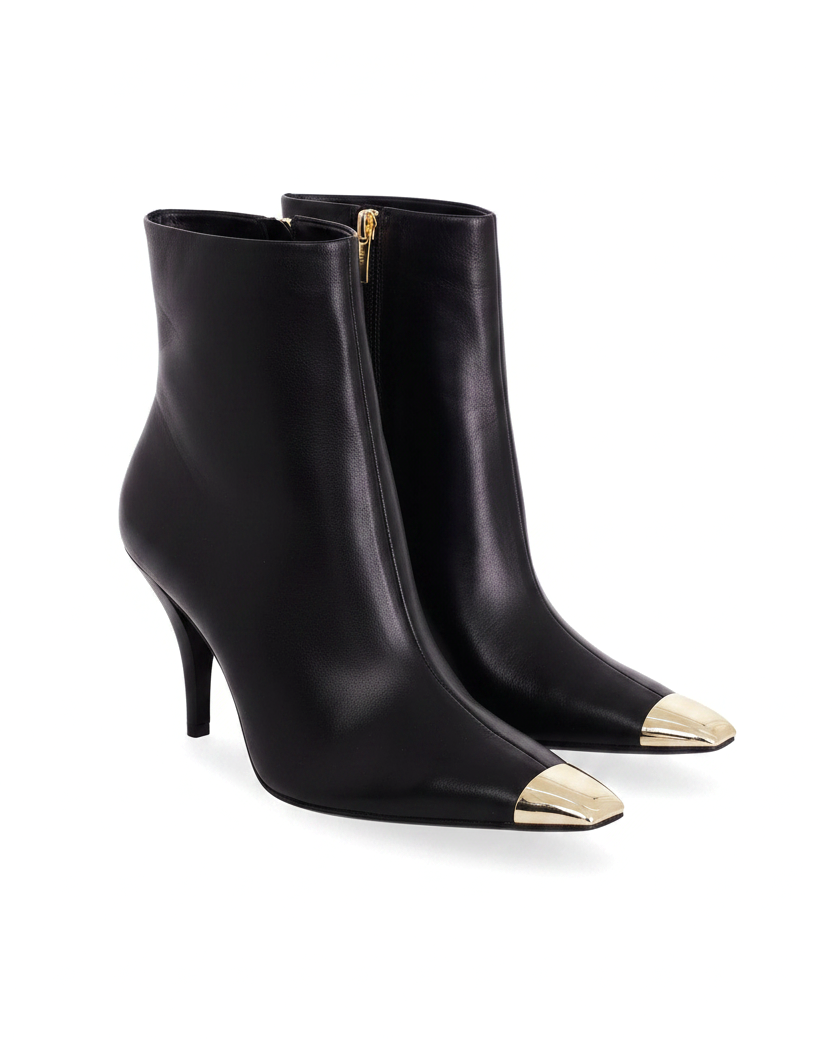 Inga black leather ankle boots three quarter view showing the gold side zip