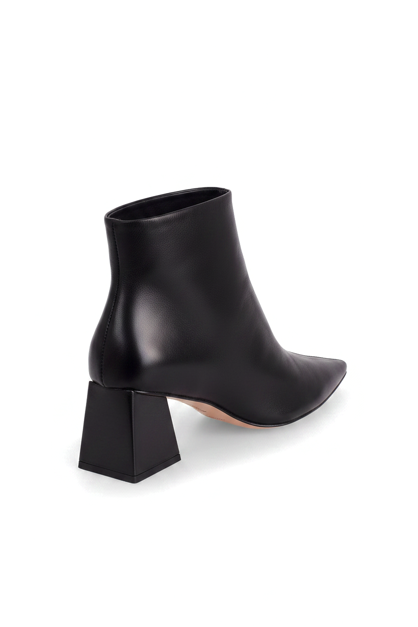 Mabea black leather ankle boots, three quarter rear view showing the flared trapeze heel