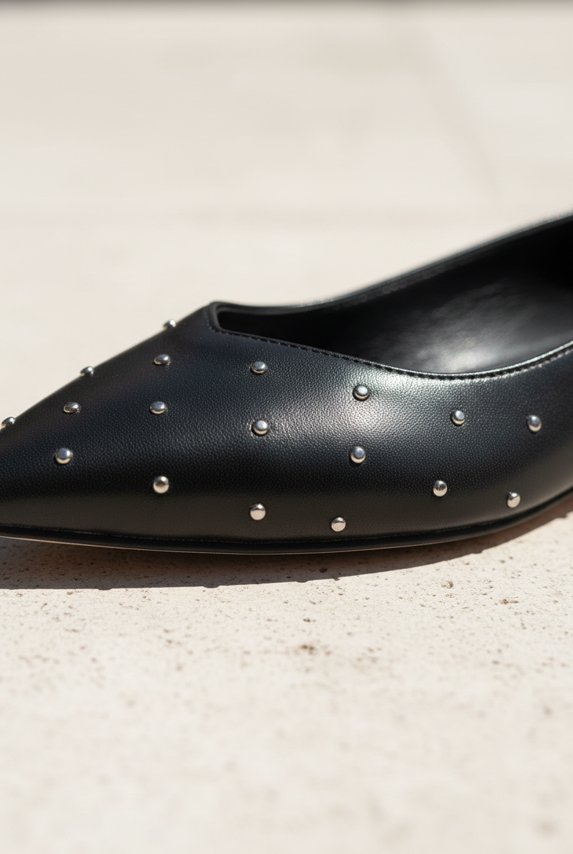 Close-up of Hamelia black leather ballerina scattered silver studs