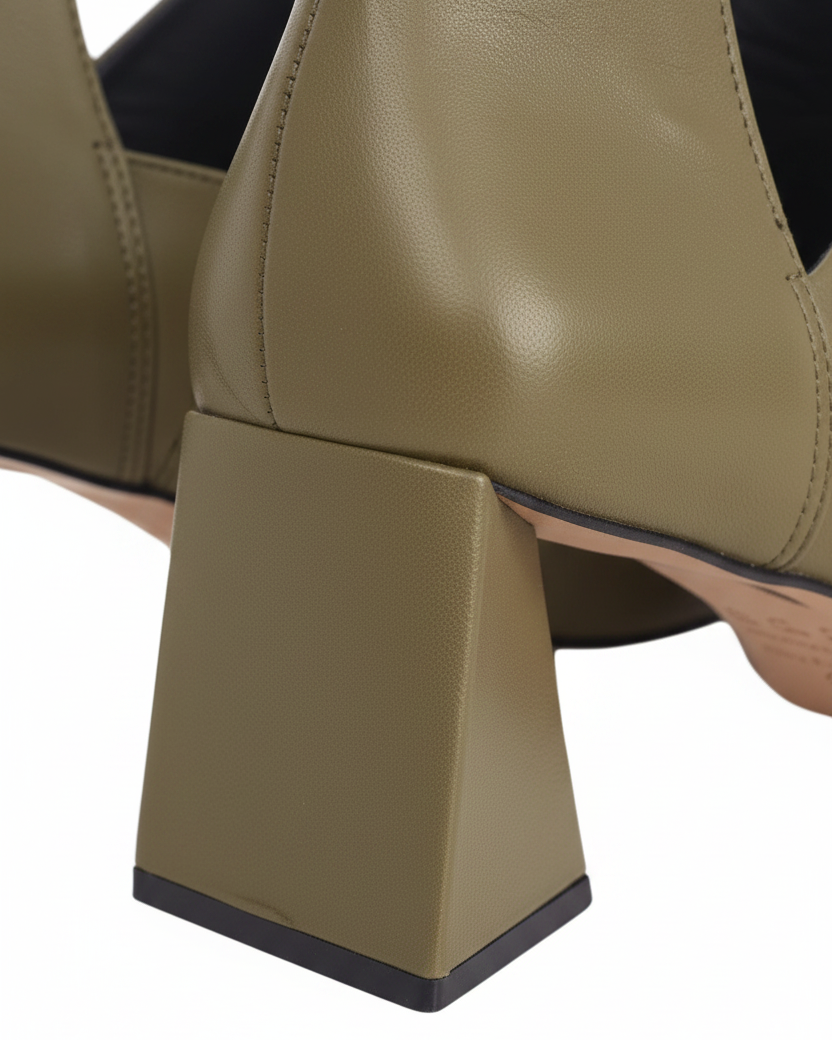 Close up of the flared trapeze block heel on Maranta olive green leather ankle boots