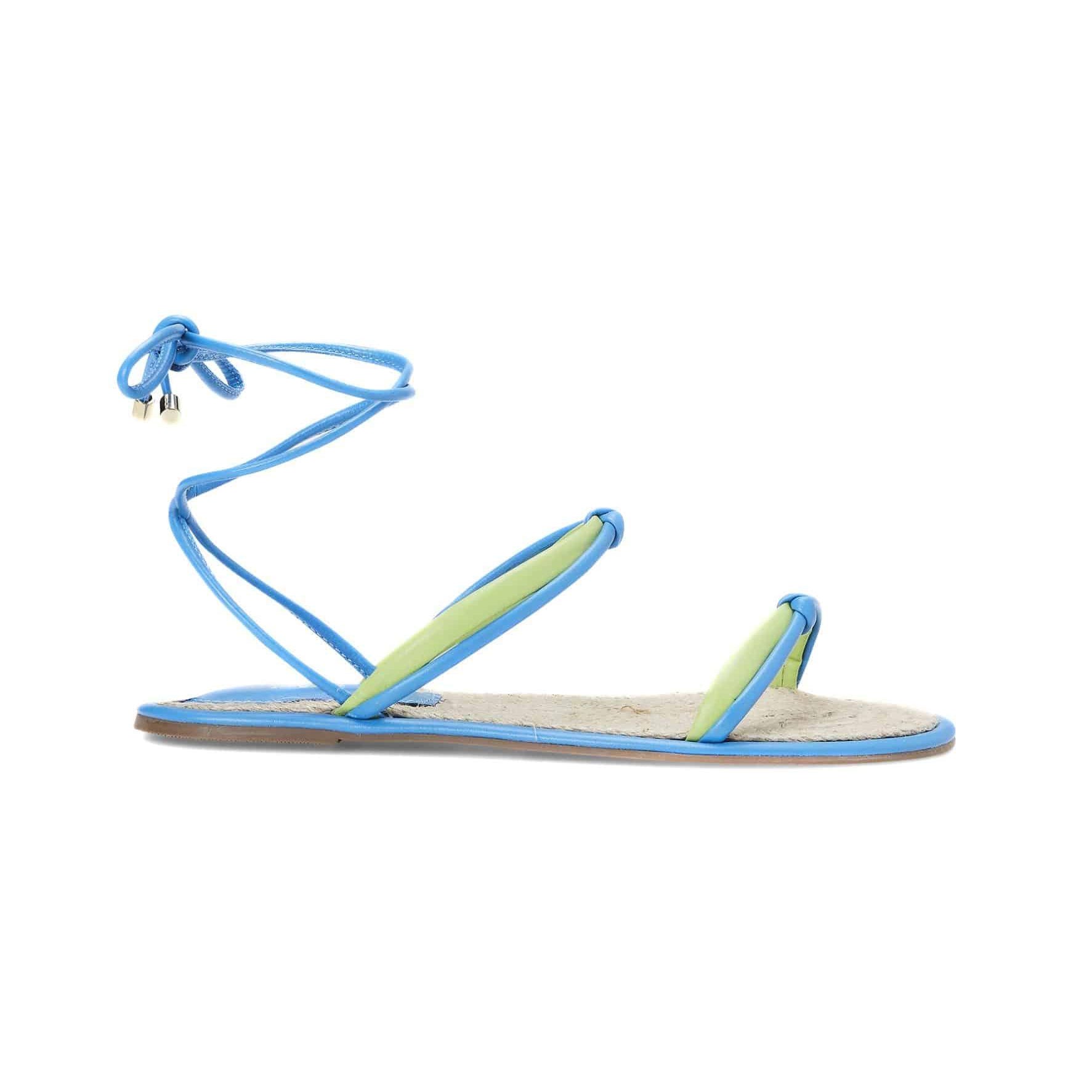 Elegant leather lace-up sandals in pink and blue. Flat, strappy, open-toe design for comfort and style. Perfect summer, vacation, and casual wear