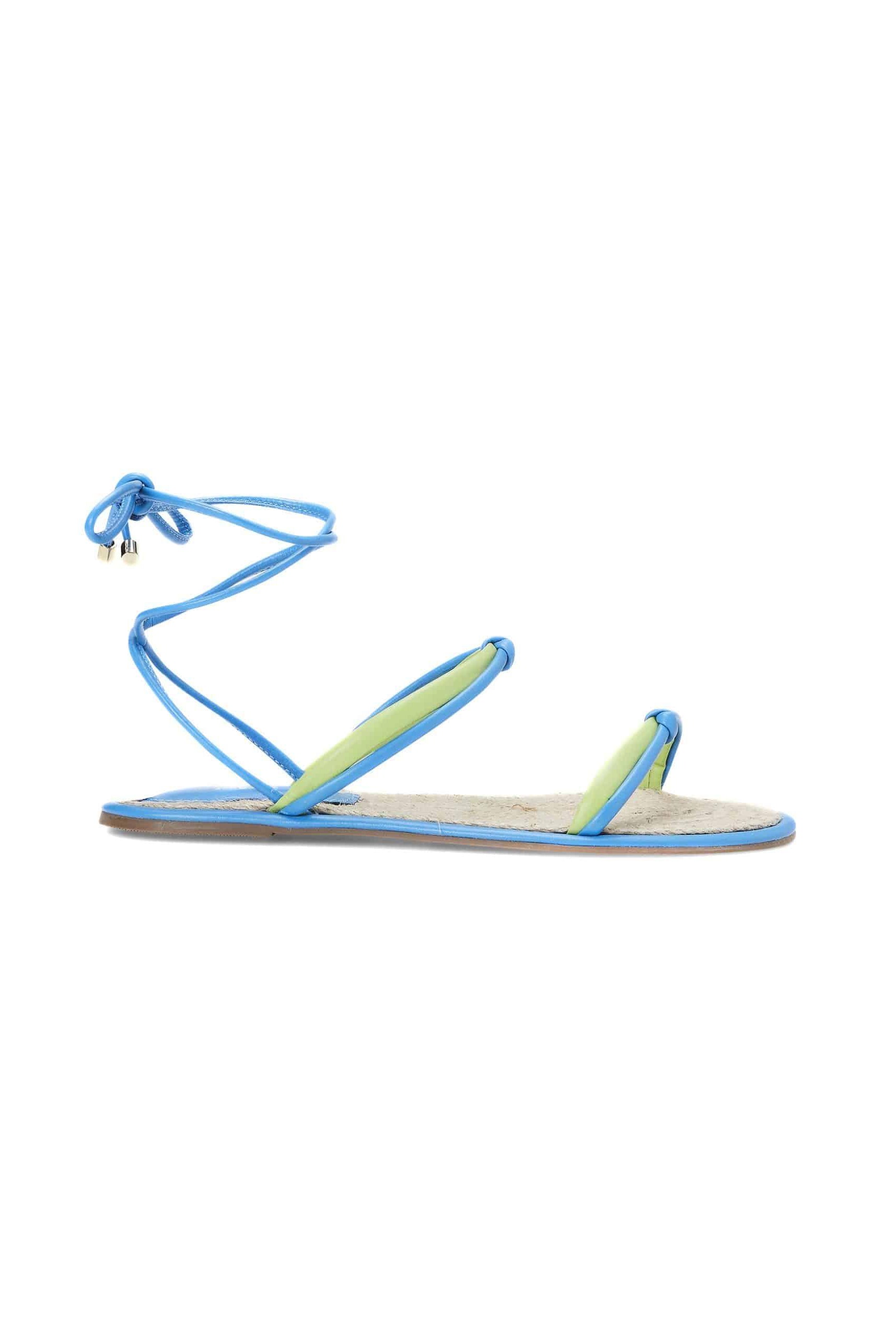 Elegant leather lace-up sandals in pink and blue. Flat, strappy, open-toe design for comfort and style. Perfect summer, vacation, and casual wear