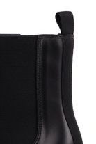 Close up detail of the woven elastic gore and pull tab on the Canna black Chelsea boots