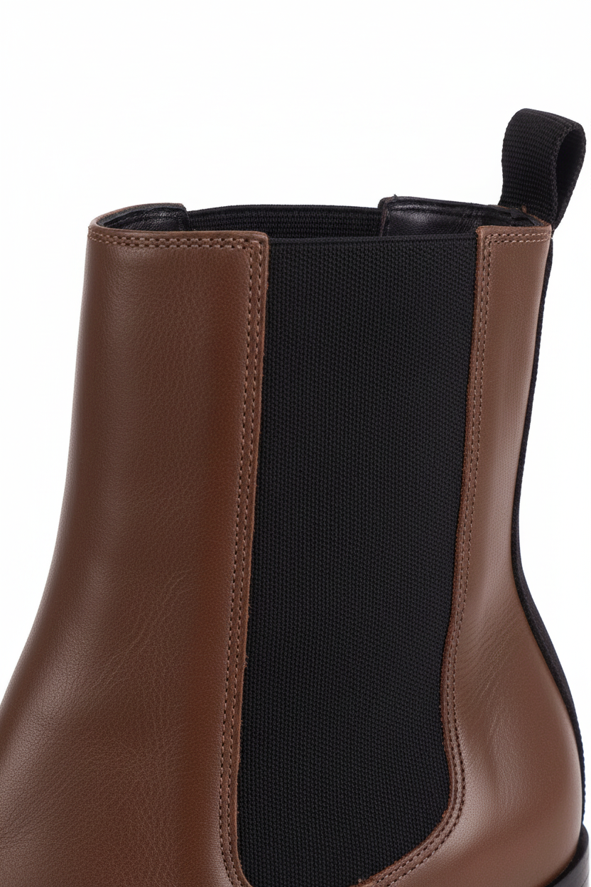 Close up detail of the black woven elastic gore against the brown leather on the Canna Chelsea boots