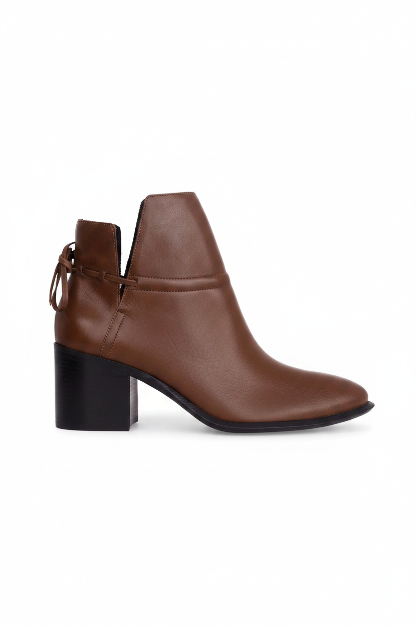 Attalea brown leather ankle boot side view showing the ankle strap, back bow and black stacked block heel