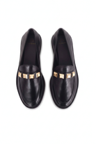 Caete black leather loafers top view showing the three gold pyramid studs on each shoe