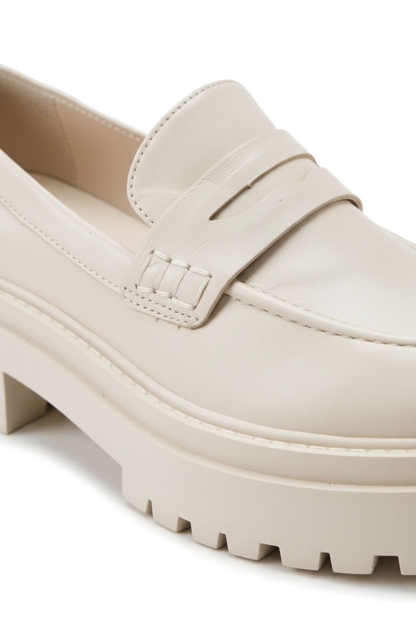 Close-up of the penny strap keyhole and lug sole on Mangara Atelier Carvalho Off-White Leather Loafers - SKU 222A0341
