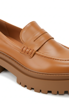 Close-up of the penny strap keyhole and lug sole on Mangara Atelier Carvalho Caramel Leather Loafers - SKU 222A0342