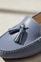 Close-up of the tassel knot detail on Caviuna blue leather loafers
