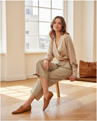 Clusia camel goat leather flat loafer, styled in a bright atelier interior