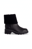 Andira black leather shearling ankle boots side view with lugged sole and 5cm block heel