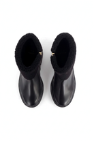 Andira black leather shearling ankle boots top view showing the gold side zip pull
