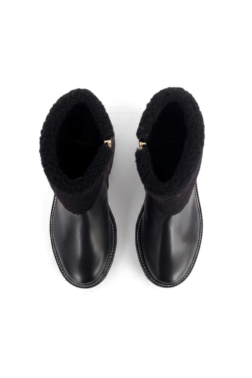 Andira black leather shearling ankle boots top view showing the gold side zip pull