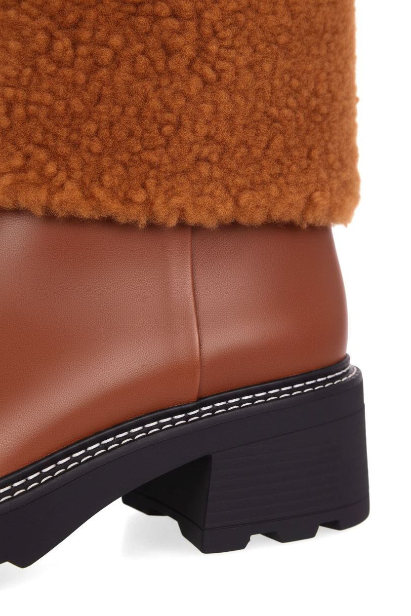 Close up of white contrast welt stitching on Andira brown leather ankle boot