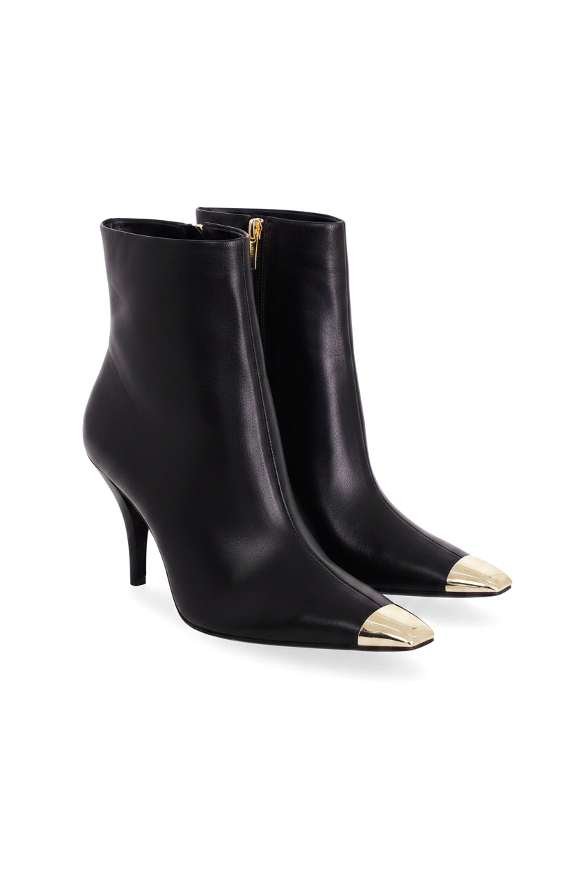 Inga black leather ankle boots three quarter view showing the gold side zip