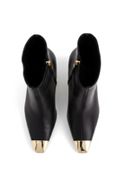 Inga black leather ankle boots top view showing the pointed gold toe caps