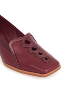 Close-up of the interlaced metallic burgundy leather chain and piping on Mangara Cordia burgundy leather loafers