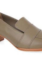 Close-up of the vamp strap and stacked wooden heel on Mangara Atelier Louro Olive Green Loafers - SKU MOMA