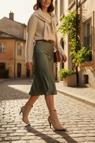Inga Beige Leather Ankle Boots – Gold Toe Cap, 8.7cm Stiletto Heel — AI-generated editorial photo
