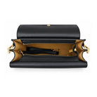 Mondieux Madame Jules leather bag, open top view showing the tan interior and detachable strap.
