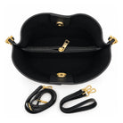 Mondieux Madame Tatie Cow leather bucket bag, open view showing the dark interior, central zipper and straps.